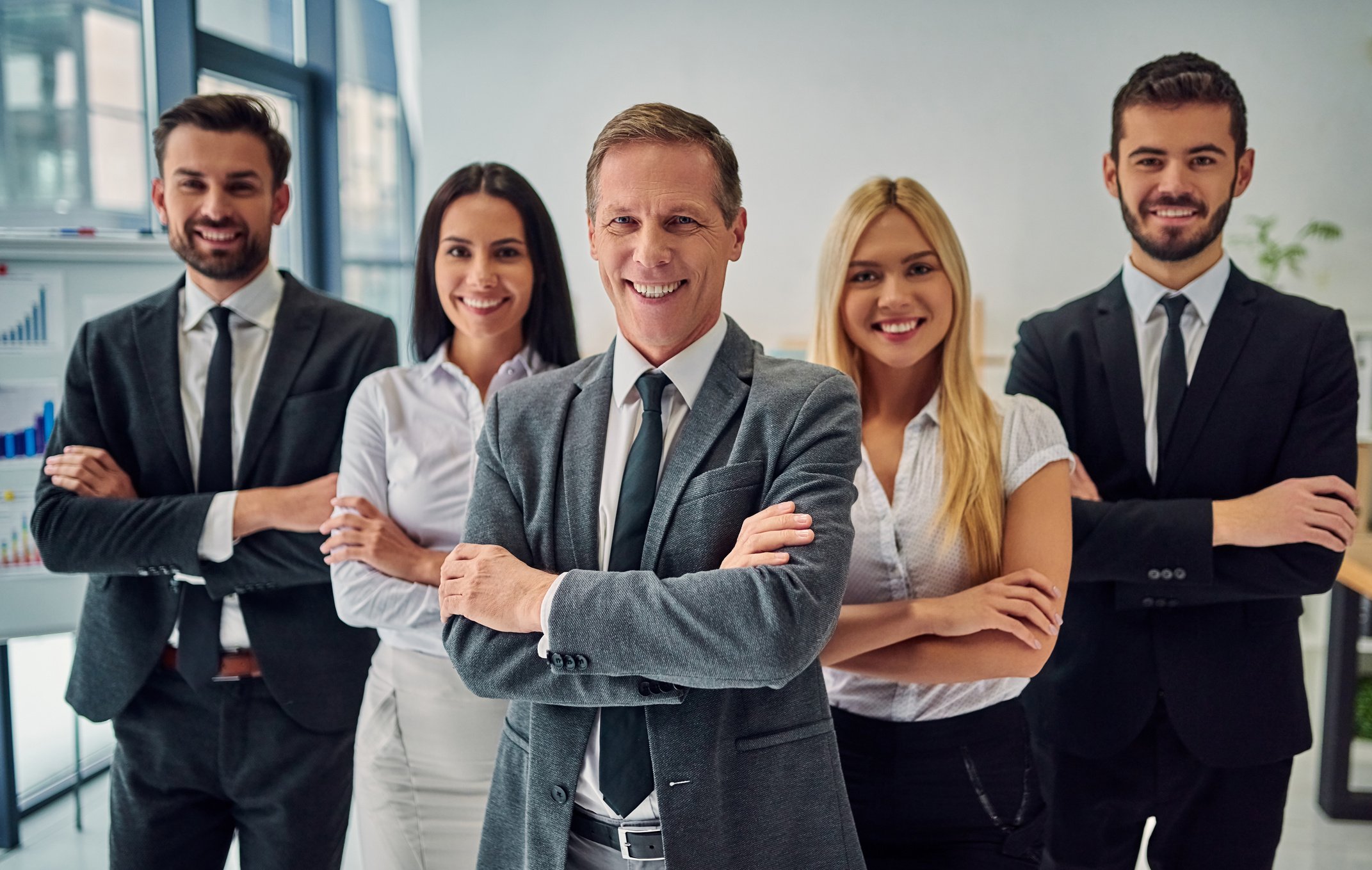 Business people working together in office. Group of office workers.